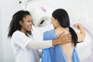 doctor giving woman a mammogram