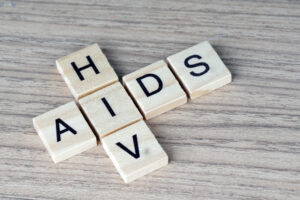 AIDS/HIV word on a wooden table