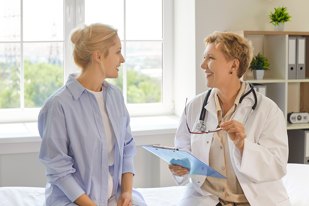 Female doctor talking with a patient during a consultation